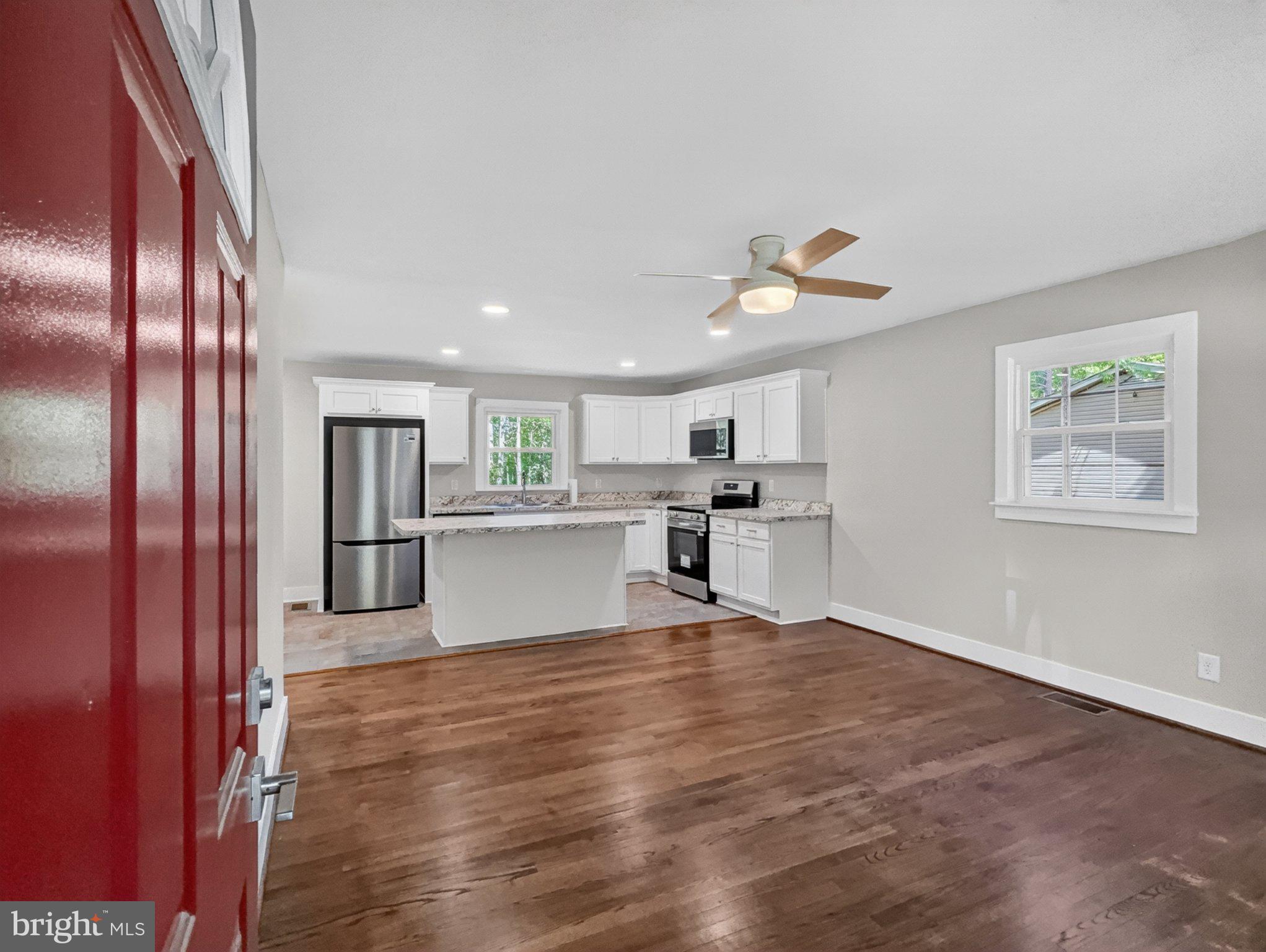 5408 Towles Mill Road Partlow, VA 22534 - Photo 8 of 24 a view of kitchen with wooden floor and window
