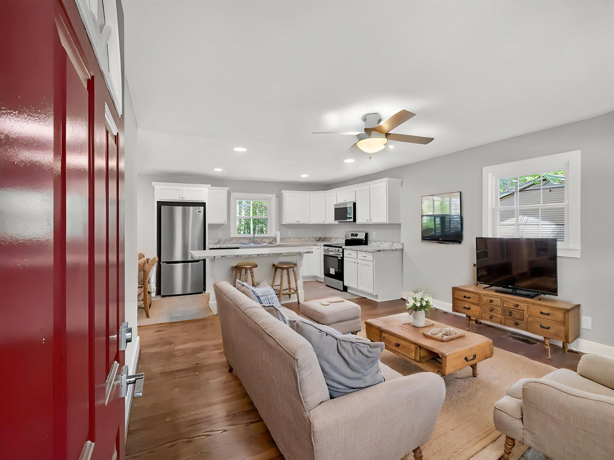 5408 Towles Mill Road Partlow, VA 22534 - Photo 9 of 24 a living room with furniture kitchen view and a flat screen tv