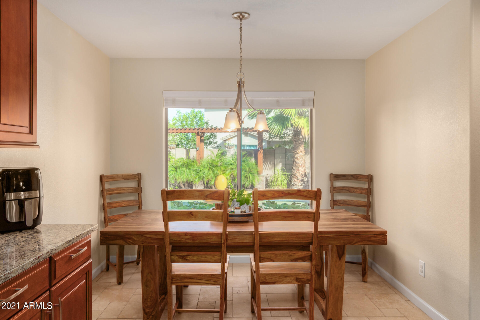 1250 South Palm Street Gilbert, AZ 85296 - Photo 15 of 45 a view of a dining room with furniture window and outside view