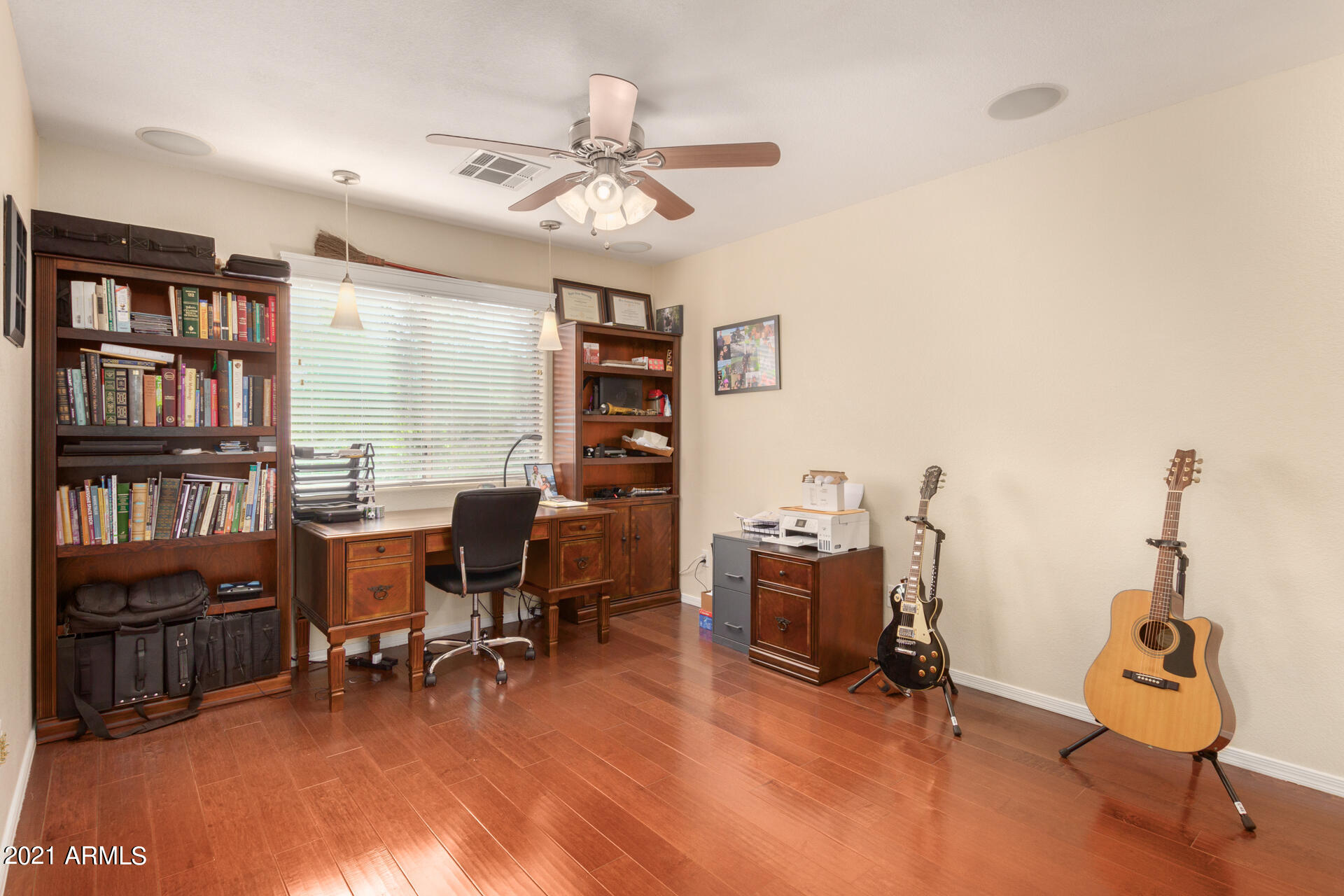1250 South Palm Street Gilbert, AZ 85296 - Photo 18 of 45 a view of a workspace with furniture and a window
