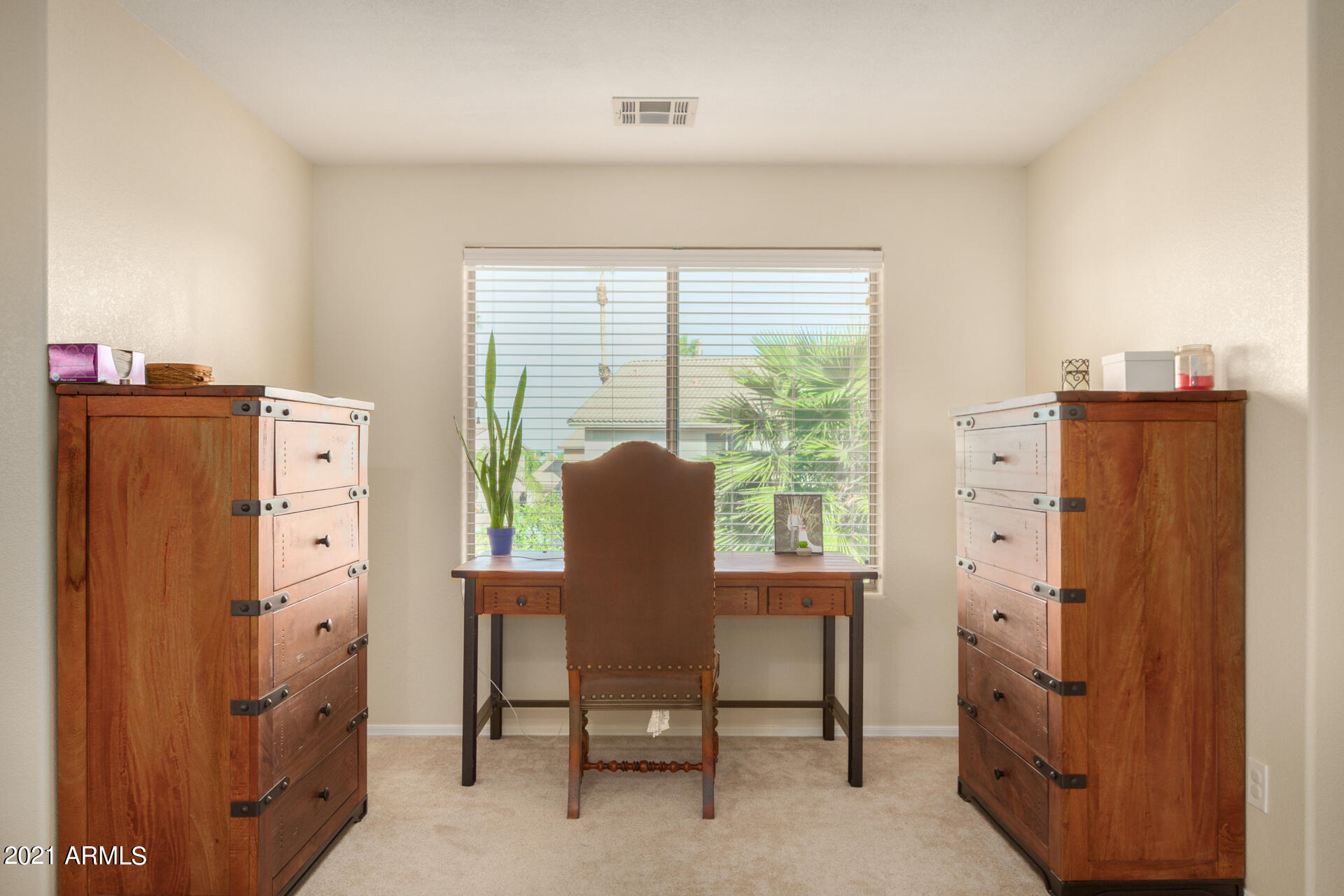 1250 South Palm Street Gilbert, AZ 85296 - Photo 21 of 45 a view of a workspace with furniture and a window