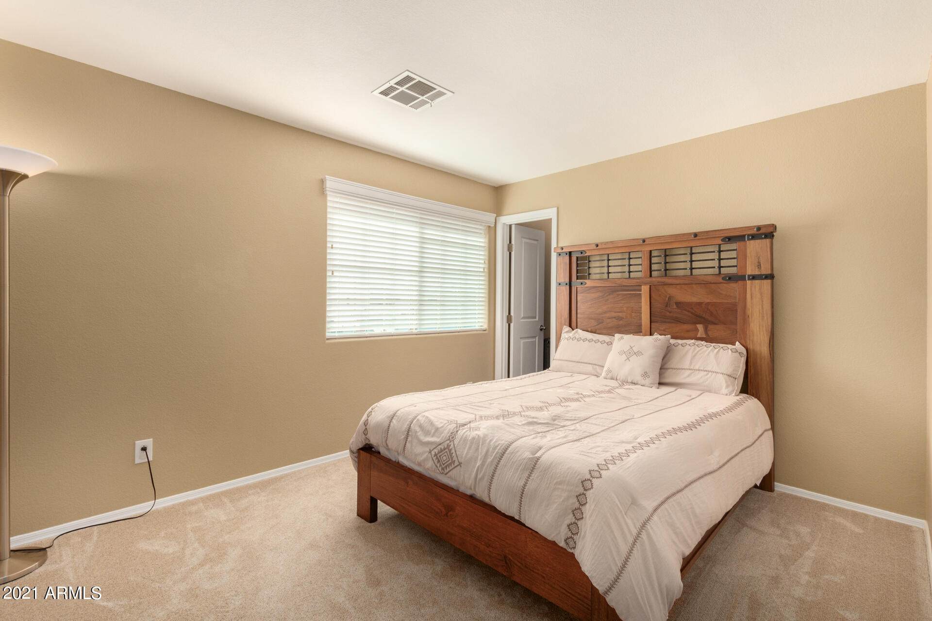 1250 South Palm Street Gilbert, AZ 85296 - Photo 25 of 45 a bedroom with a bed and a window