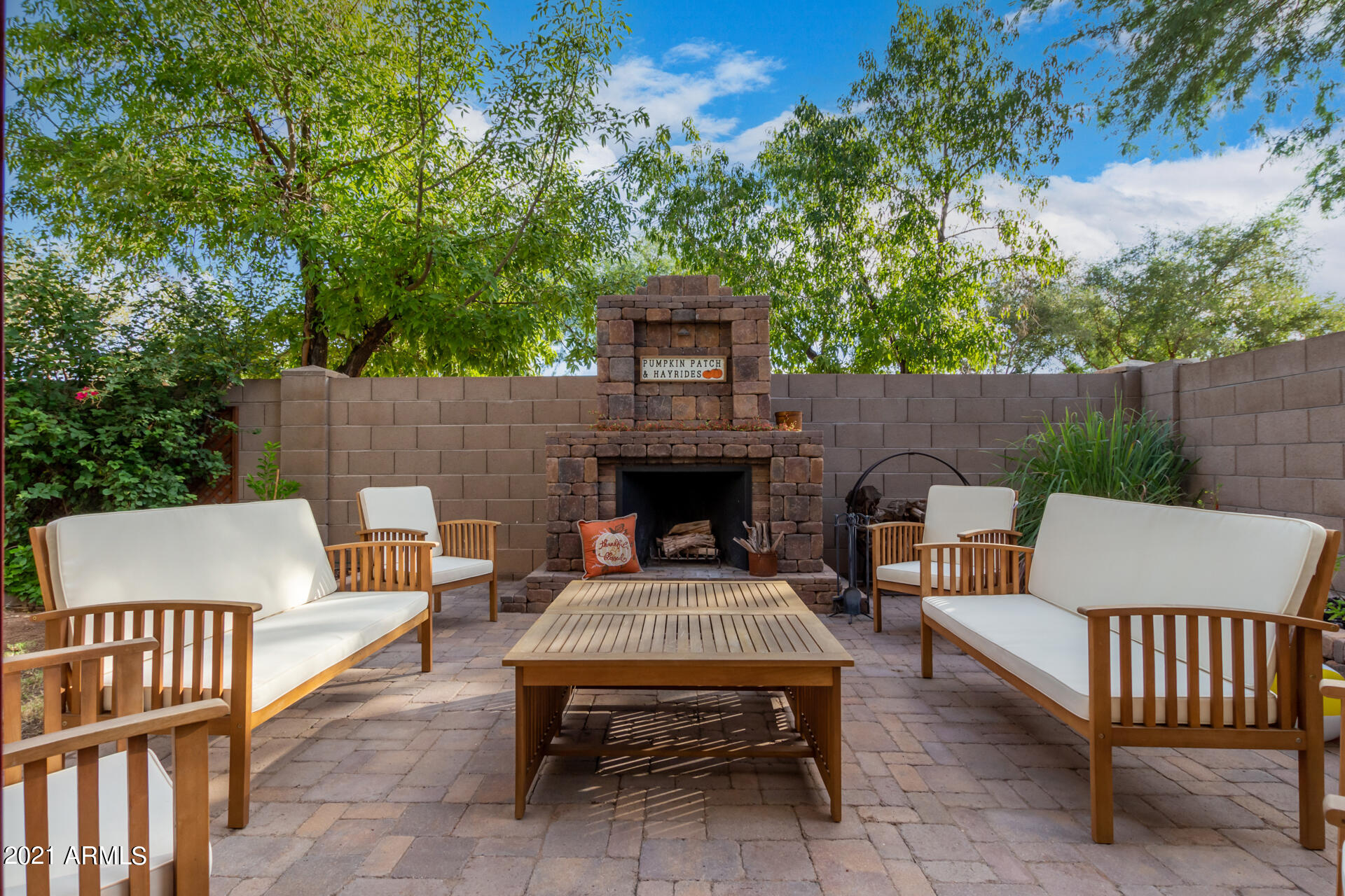 1250 South Palm Street Gilbert, AZ 85296 - Photo 35 of 45 a view of a patio with a table and chairs