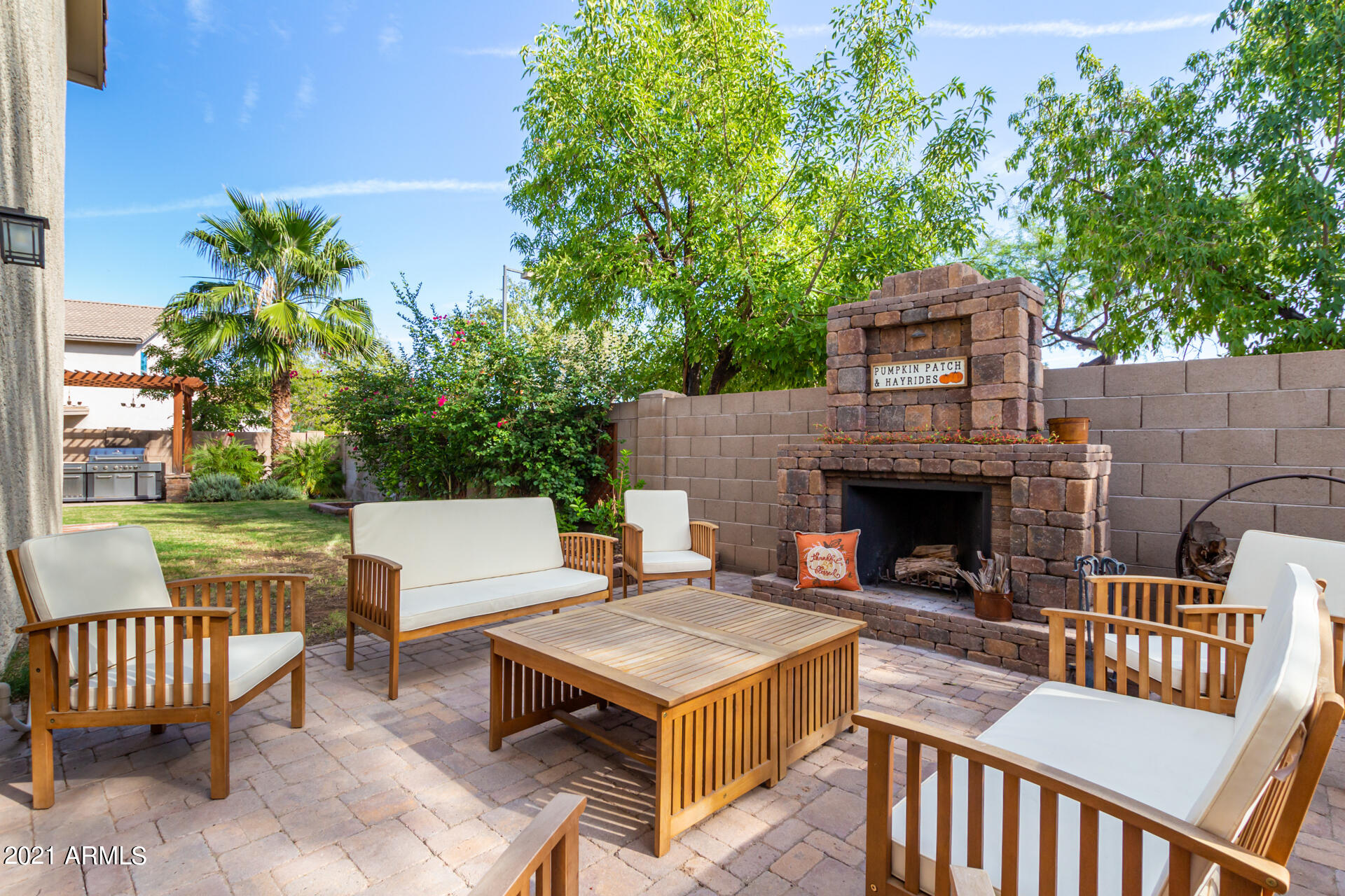 1250 South Palm Street Gilbert, AZ 85296 - Photo 36 of 45 a outdoor space with a couch and a fireplace