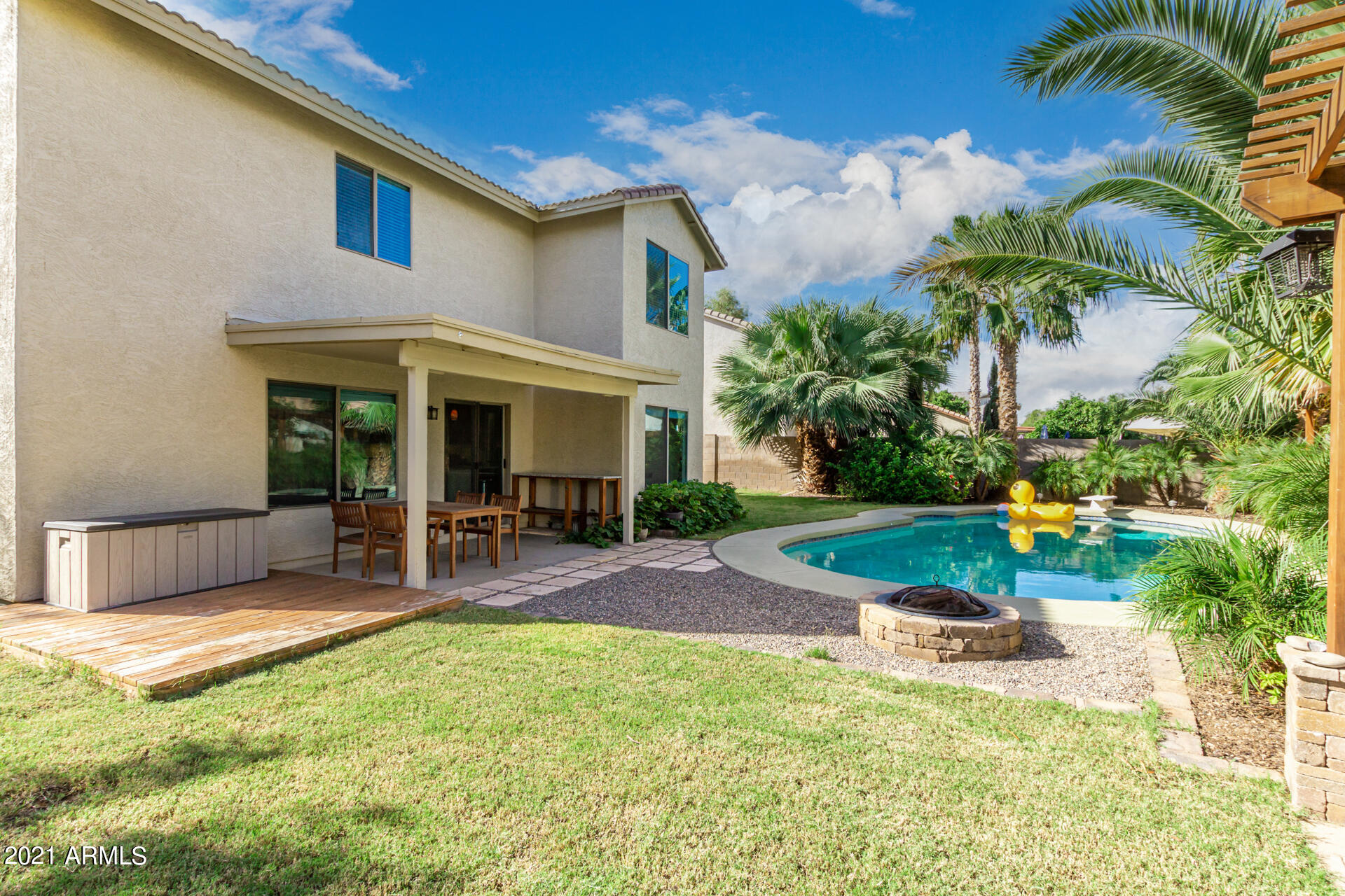 1250 South Palm Street Gilbert, AZ 85296 - Photo 43 of 45 a view of a house with backyard porch and swimming pool