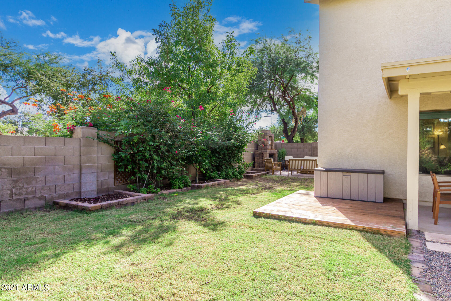 1250 South Palm Street Gilbert, AZ 85296 - Photo 44 of 45 a view of a chair and table in the backyard with wooden fence