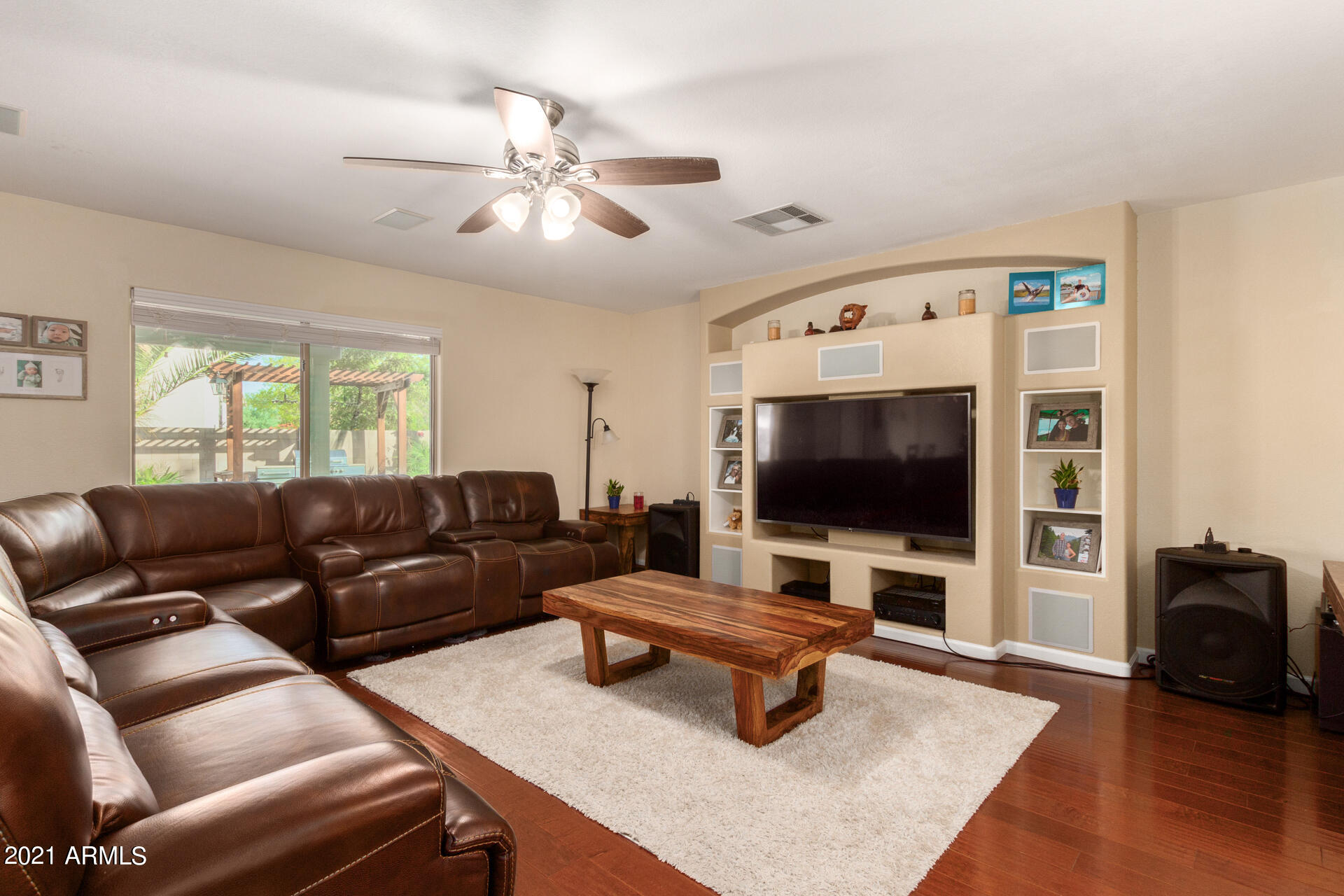 1250 South Palm Street Gilbert, AZ 85296 - Photo 5 of 45 a living room with furniture and a flat screen tv