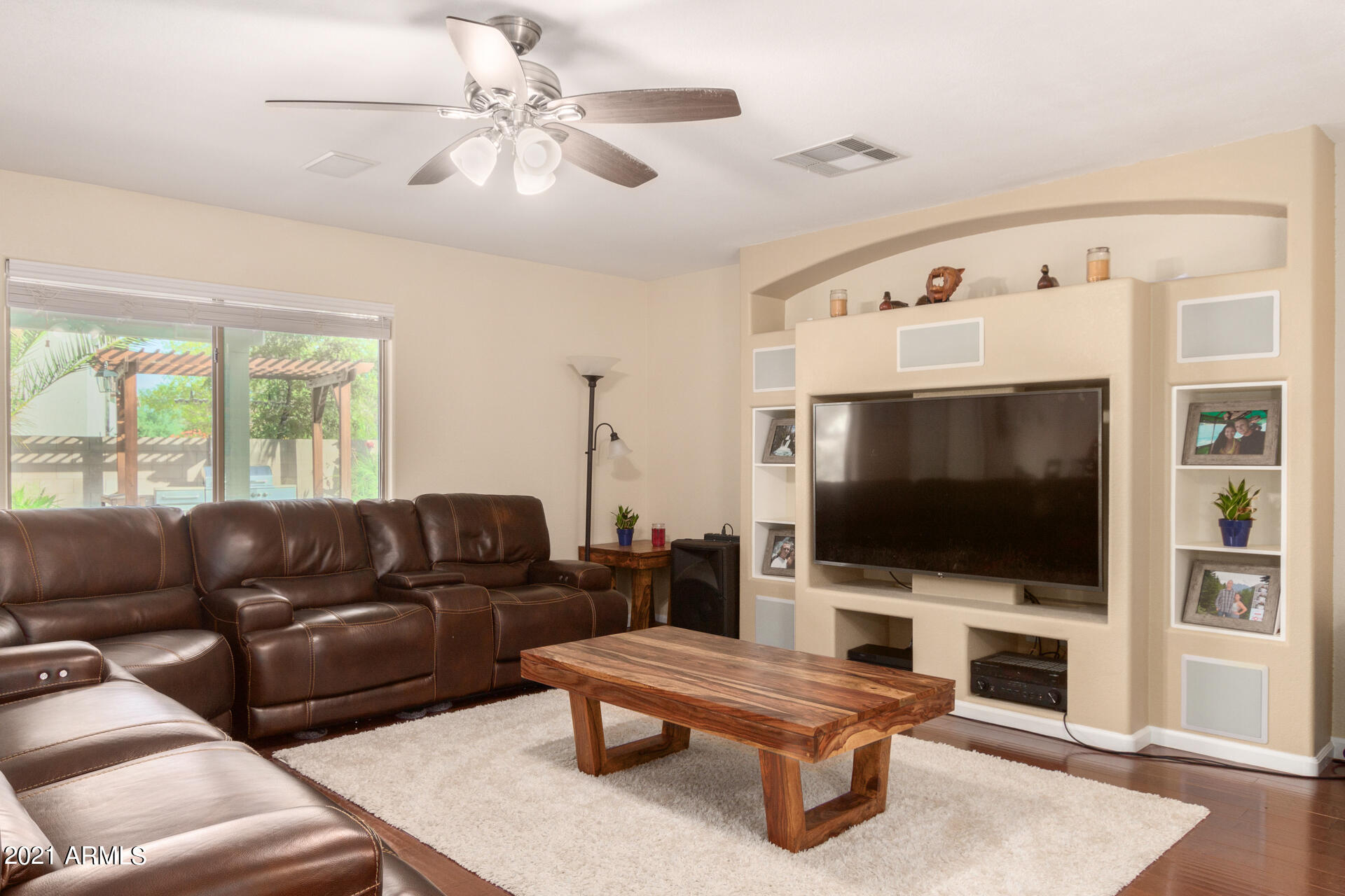 1250 South Palm Street Gilbert, AZ 85296 - Photo 7 of 45 a living room with furniture and a flat screen tv