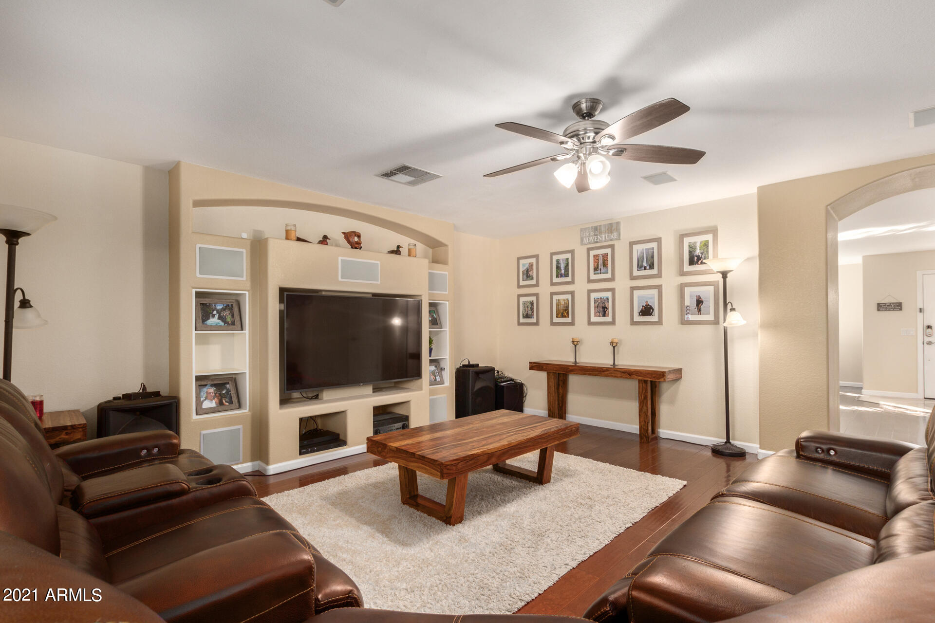 1250 South Palm Street Gilbert, AZ 85296 - Photo 8 of 45 a living room with furniture a flat screen tv and kitchen view
