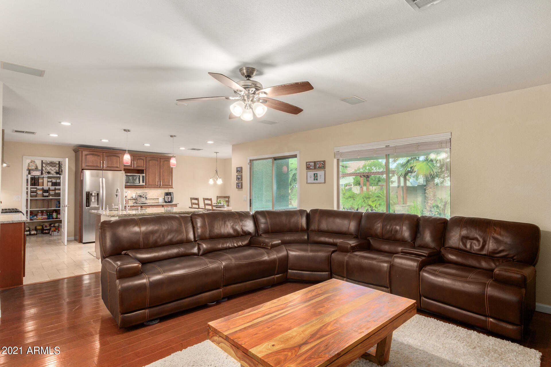 1250 South Palm Street Gilbert, AZ 85296 - Photo 9 of 45 a view of a living room a wooden floor and a chandelier