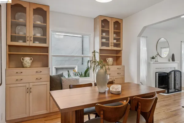 a dining room with furniture and wooden floor