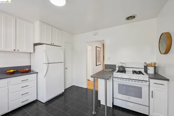 a utility room with sink dryer and washer