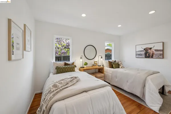 a bedroom with bed and a large window