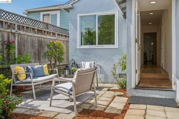 a view of a patio with couple of chairs