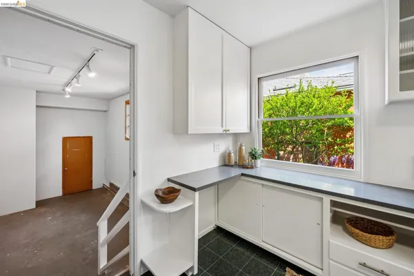a kitchen that has a sink and a stove