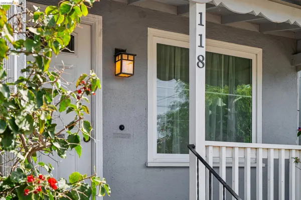 a front view of a house with a yard with flower in front