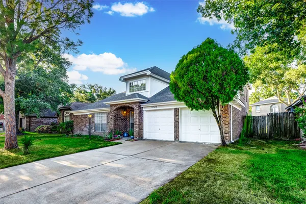 a view of house with a yard