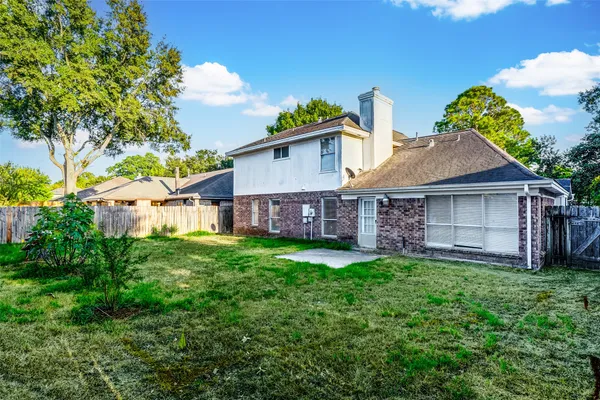 a view of a house with a yard and plants