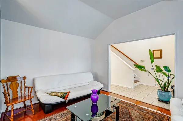 a living room with furniture and flowers