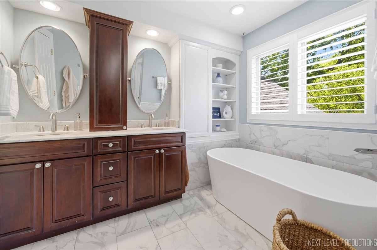 1914 North Ridge Avenue Arlington Heights, IL 60004 - Photo 24 of 50 a spacious bathroom with a granite countertop tub sink and mirror