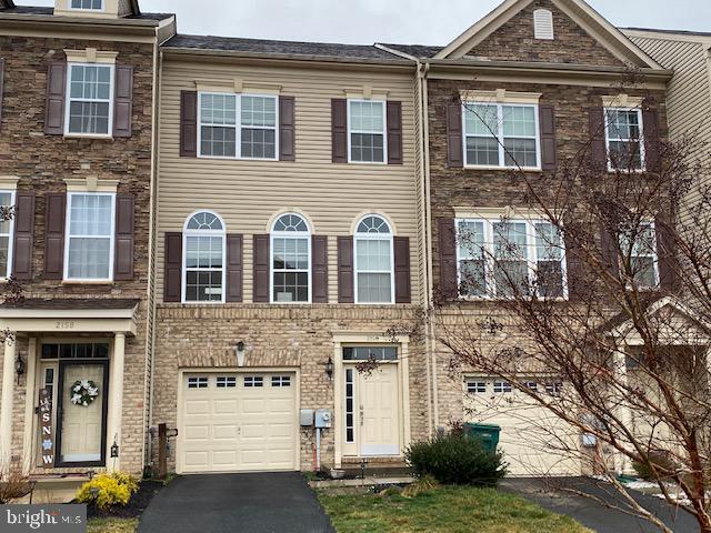 2156 Audubon Trail Middletown, DE 19709 - Photo 1 of 8 a front view of a house with a yard