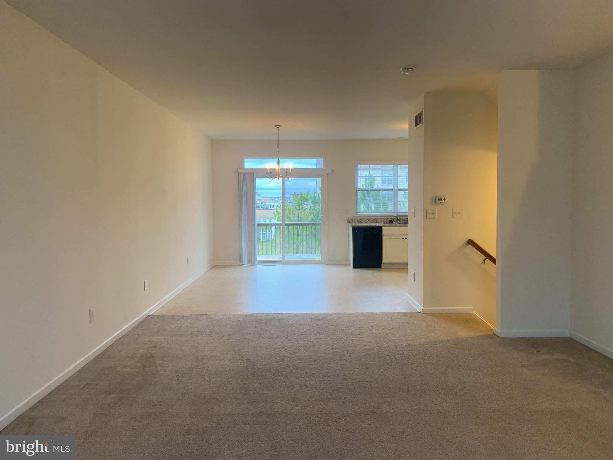 2156 Audubon Trail Middletown, DE 19709 - Photo 4 of 8 a view of a big room with windows and cabinet