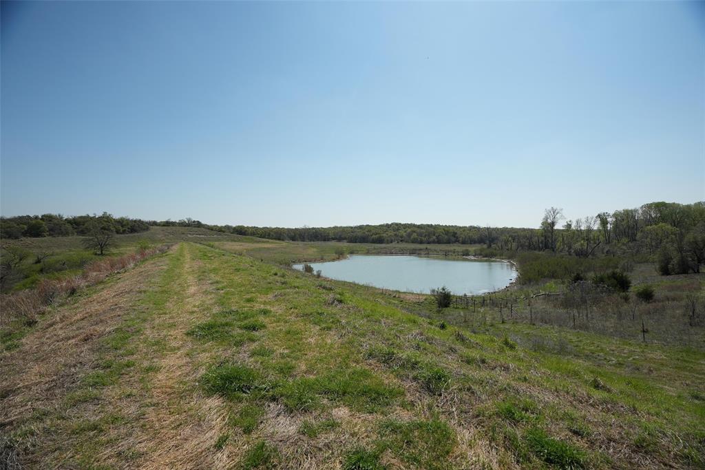 2202 County Road 3657 Springtown, TX 76082 - Photo 13 of 34 a view of a lake with a yard