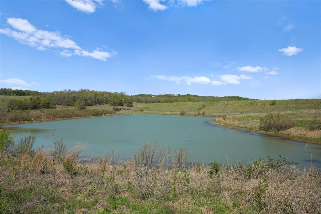 2202 County Road 3657 Springtown, TX 76082 - Photo 19 of 34 a view of lake with mountain in the background
