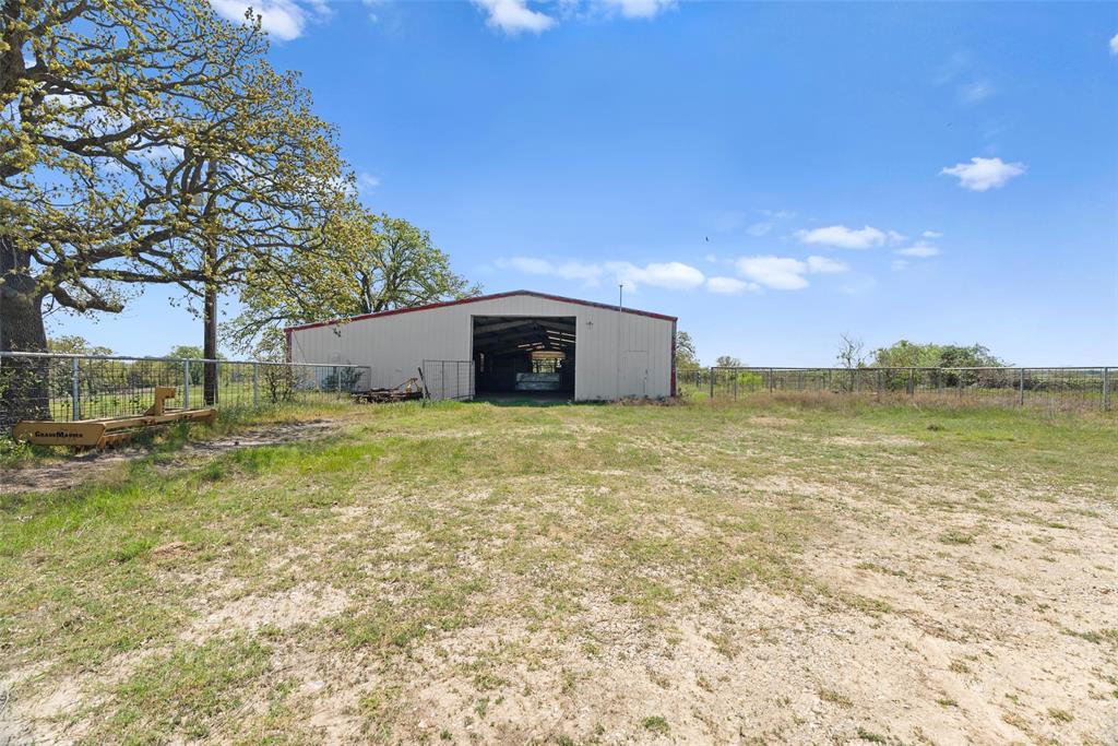 2202 County Road 3657 Springtown, TX 76082 - Photo 25 of 34 a view of a lake with a yard