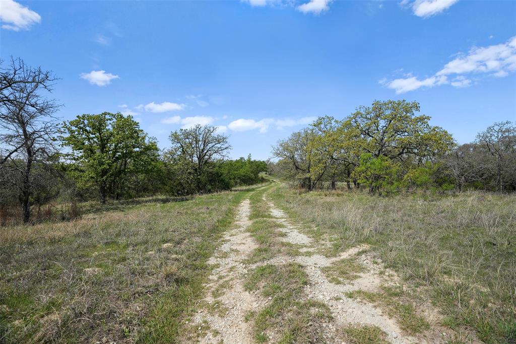 2202 County Road 3657 Springtown, TX 76082 - Photo 28 of 34 a view of a lake with a yard