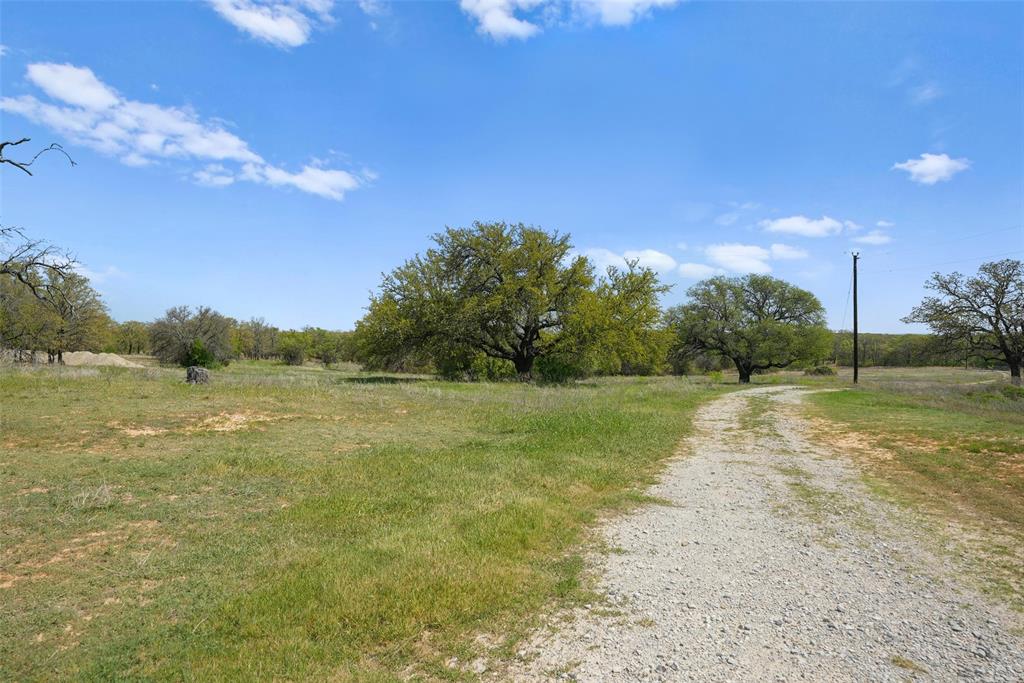 2202 County Road 3657 Springtown, TX 76082 - Photo 29 of 34 a view of a lake with houses in the background