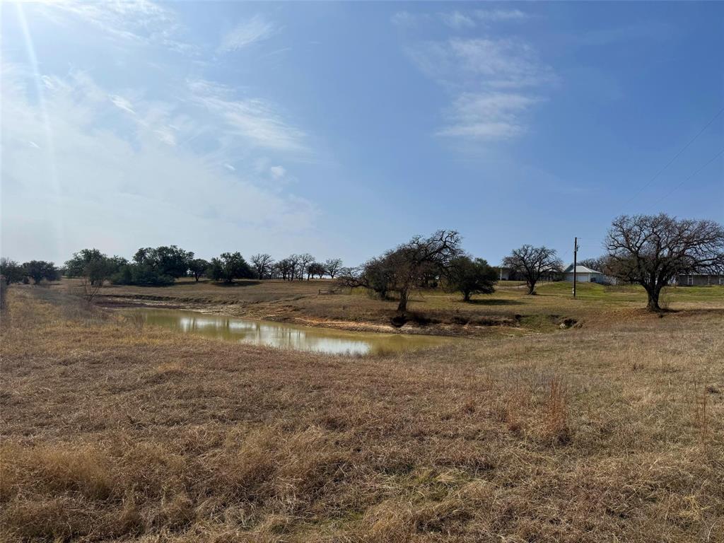 2202 County Road 3657 Springtown, TX 76082 - Photo 9 of 34 a view of a lake with houses in back