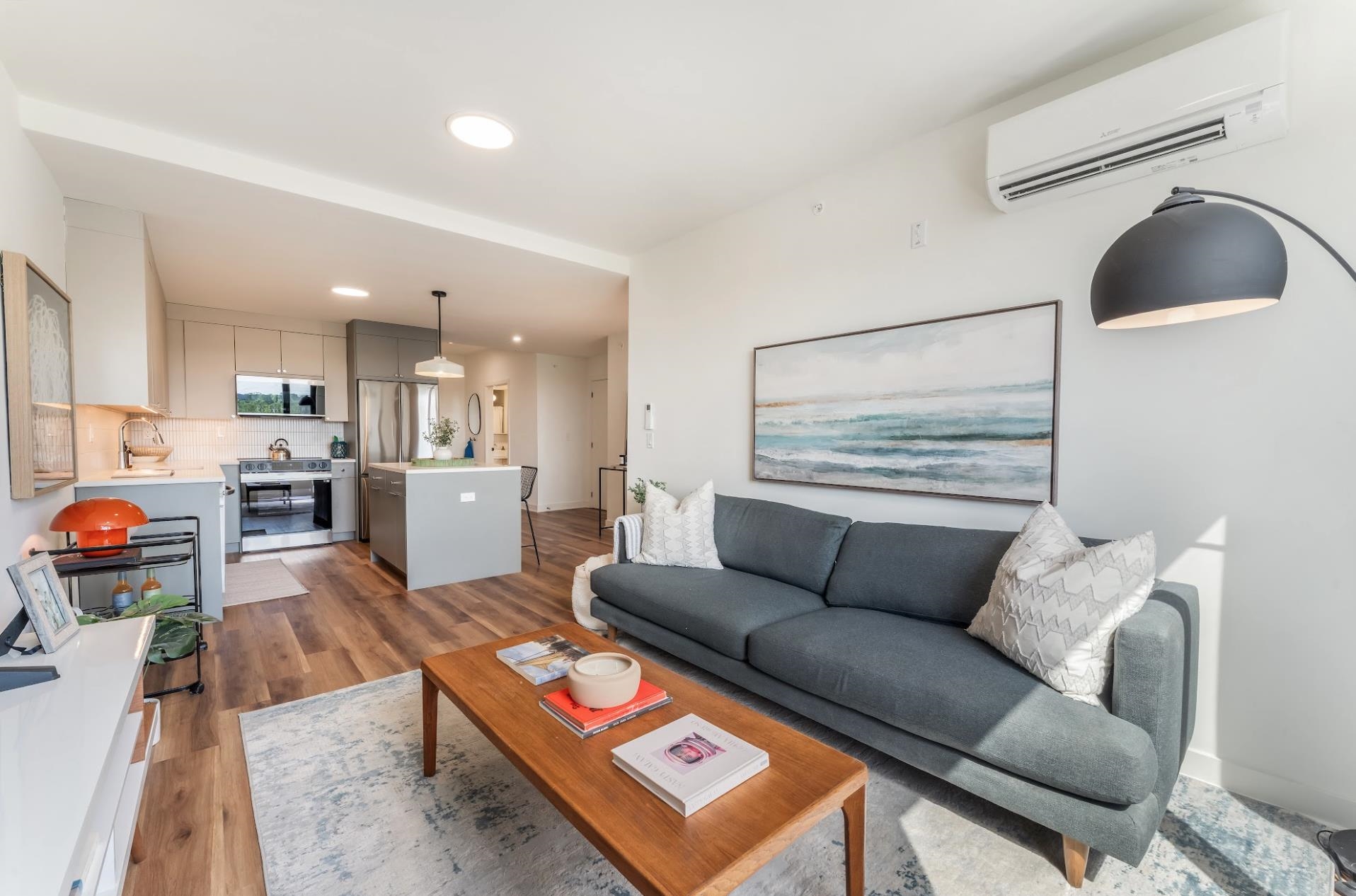 a living room with furniture and a rug