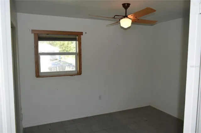 a view of a hallway with a window