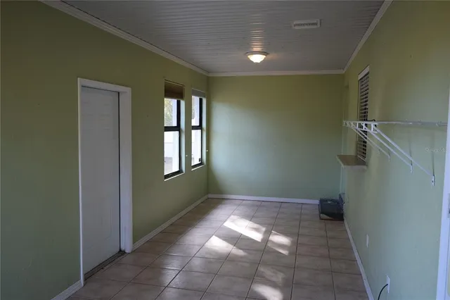 a view of an empty room and window