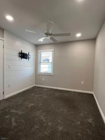 an empty room with a empty space and windows