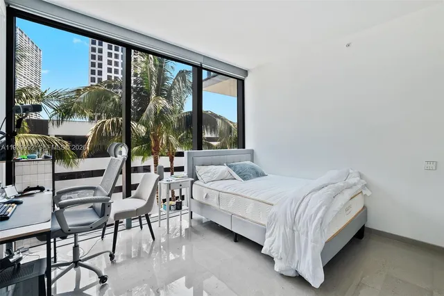 a bathroom with a sink toilet vanity and shower