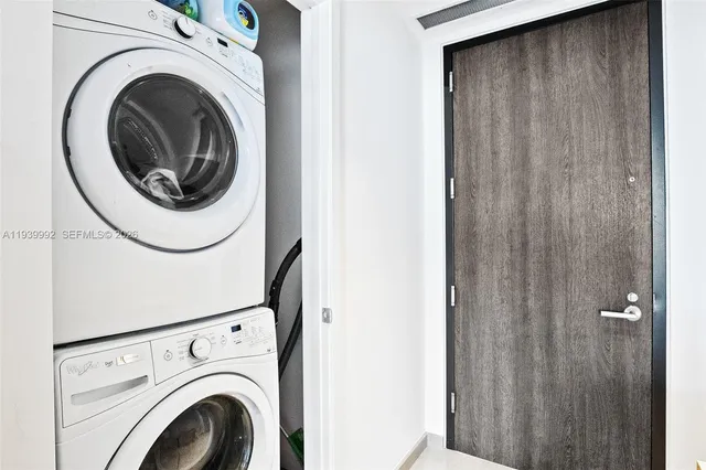 a view of a palm plant from a balcony