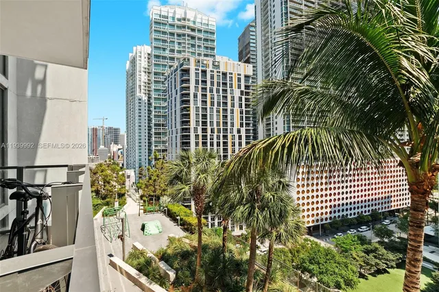 a view of balcony with wooden floor