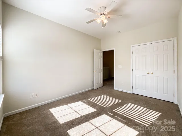 a spacious bathroom with a double vanity sink a mirror and a bathtub
