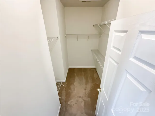 a white bath tub sitting in a bathroom next to a window