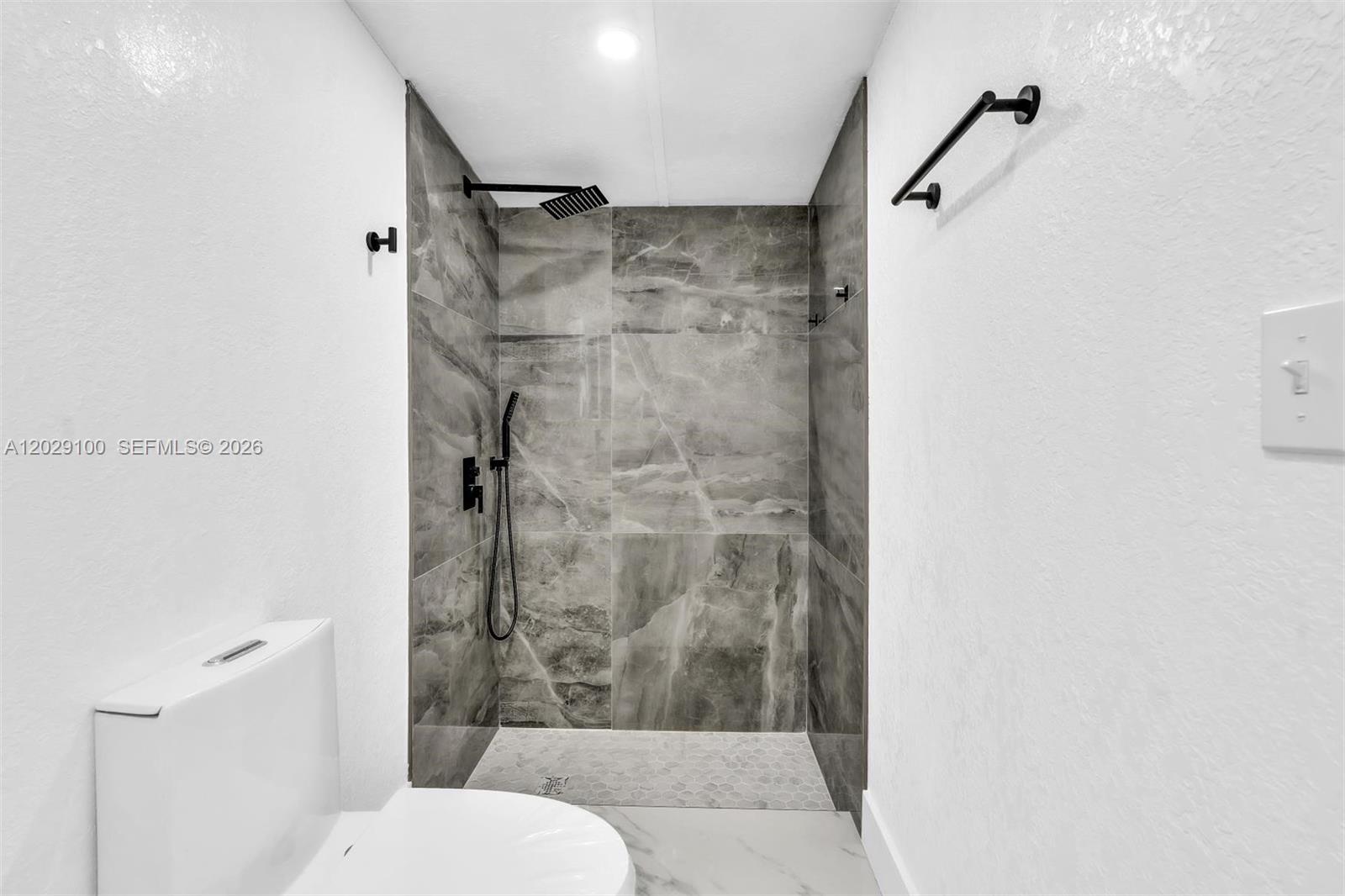 11790 Southwest 34th Street Miami, FL 33175 - Photo 44 of 56 a bathroom with a shower and toilet