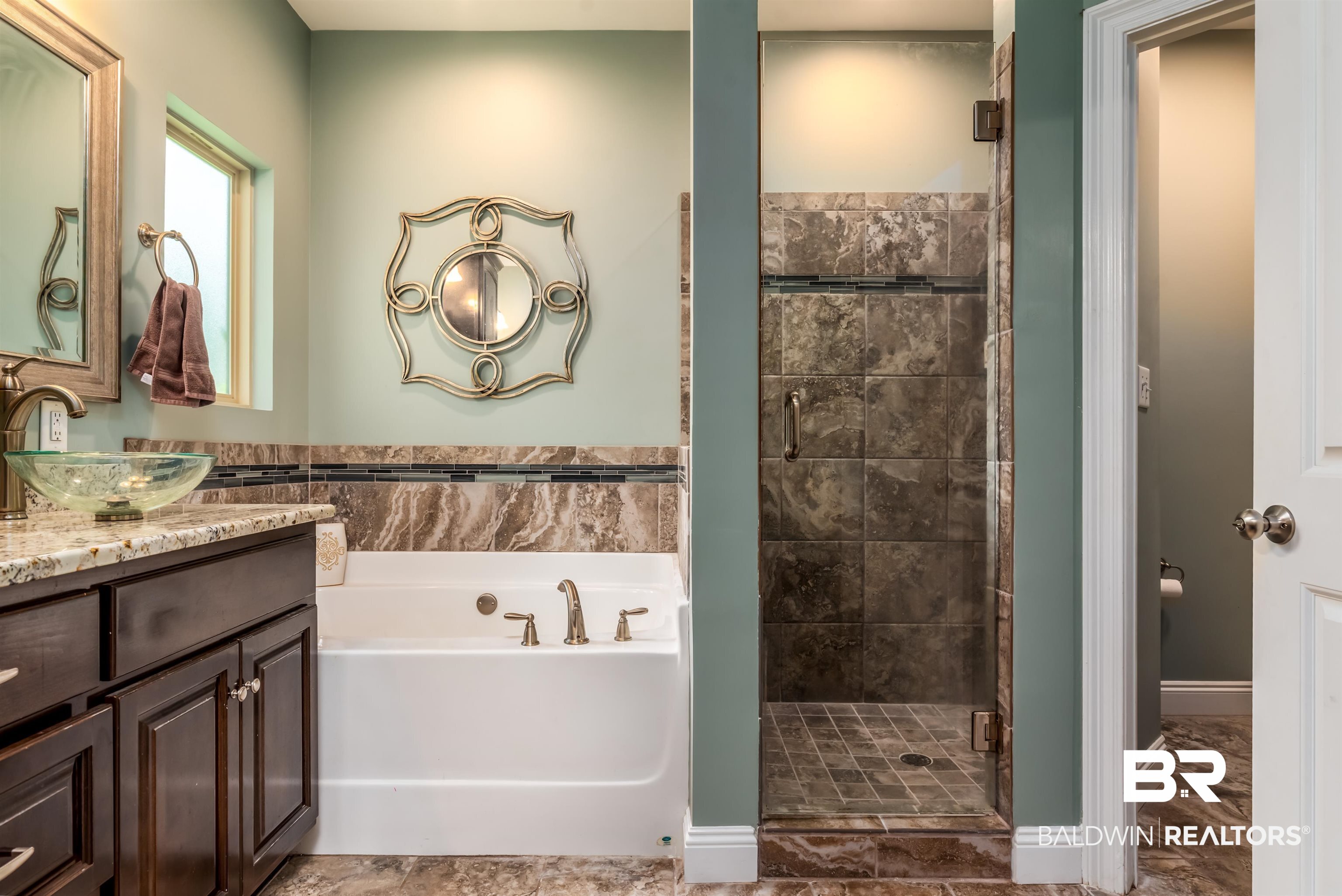 965 Henckley Avenue Mobile, AL 36609 - Photo 14 of 30 Bathroom with tile patterned floors, vanity, and shower with separate bathtub