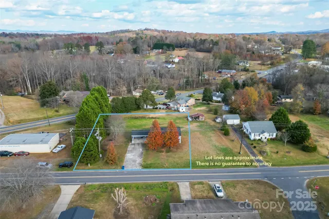 an aerial view of a residential houses with outdoor space