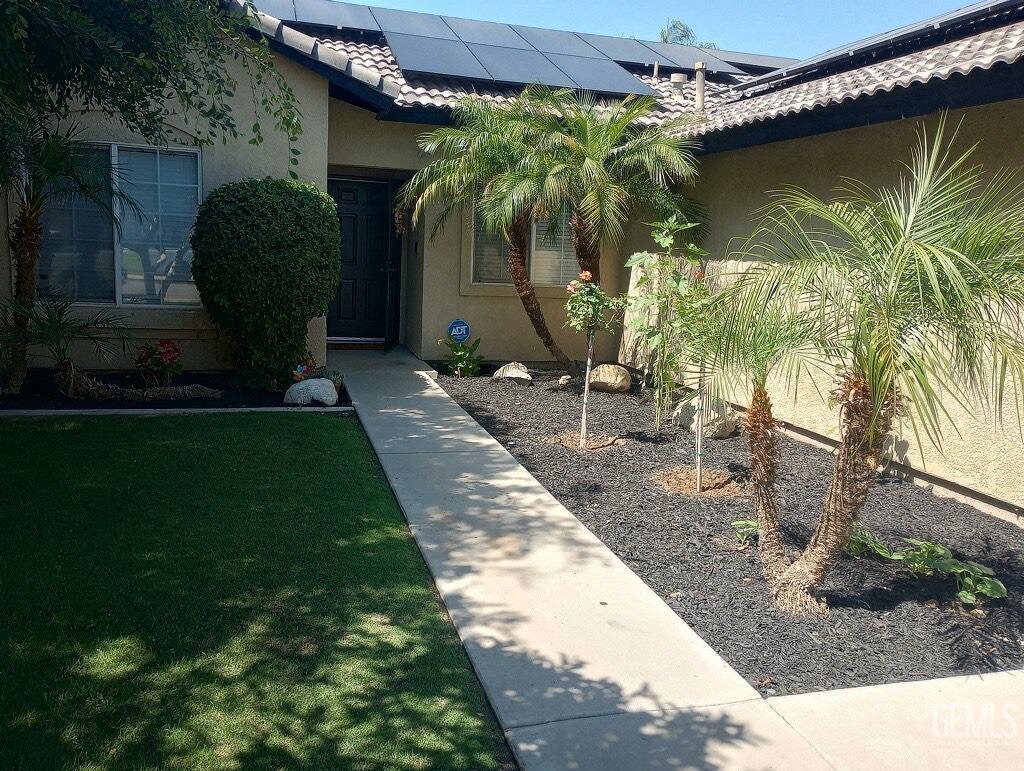 Undisclosed Address Bakersfield, CA 93313 - Photo 2 of 18 a front view of a house with garden