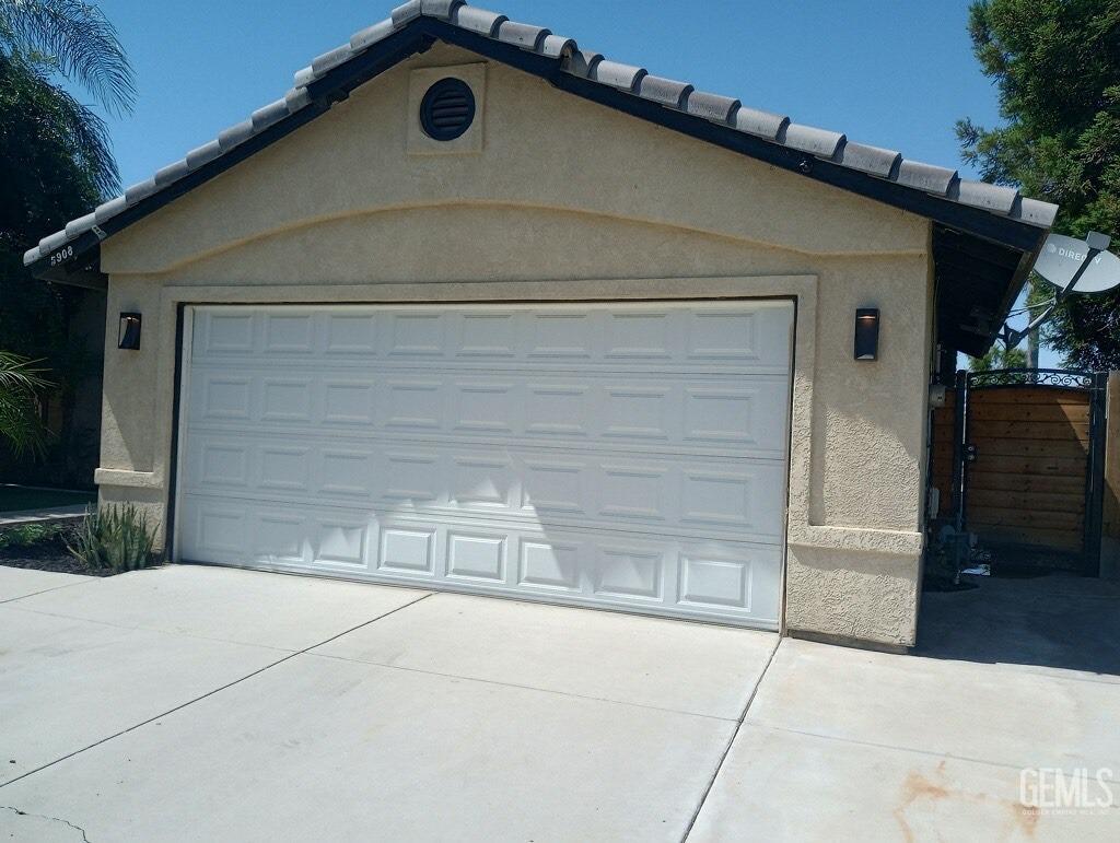 Undisclosed Address Bakersfield, CA 93313 - Photo 3 of 18 a front view of a house with a yard