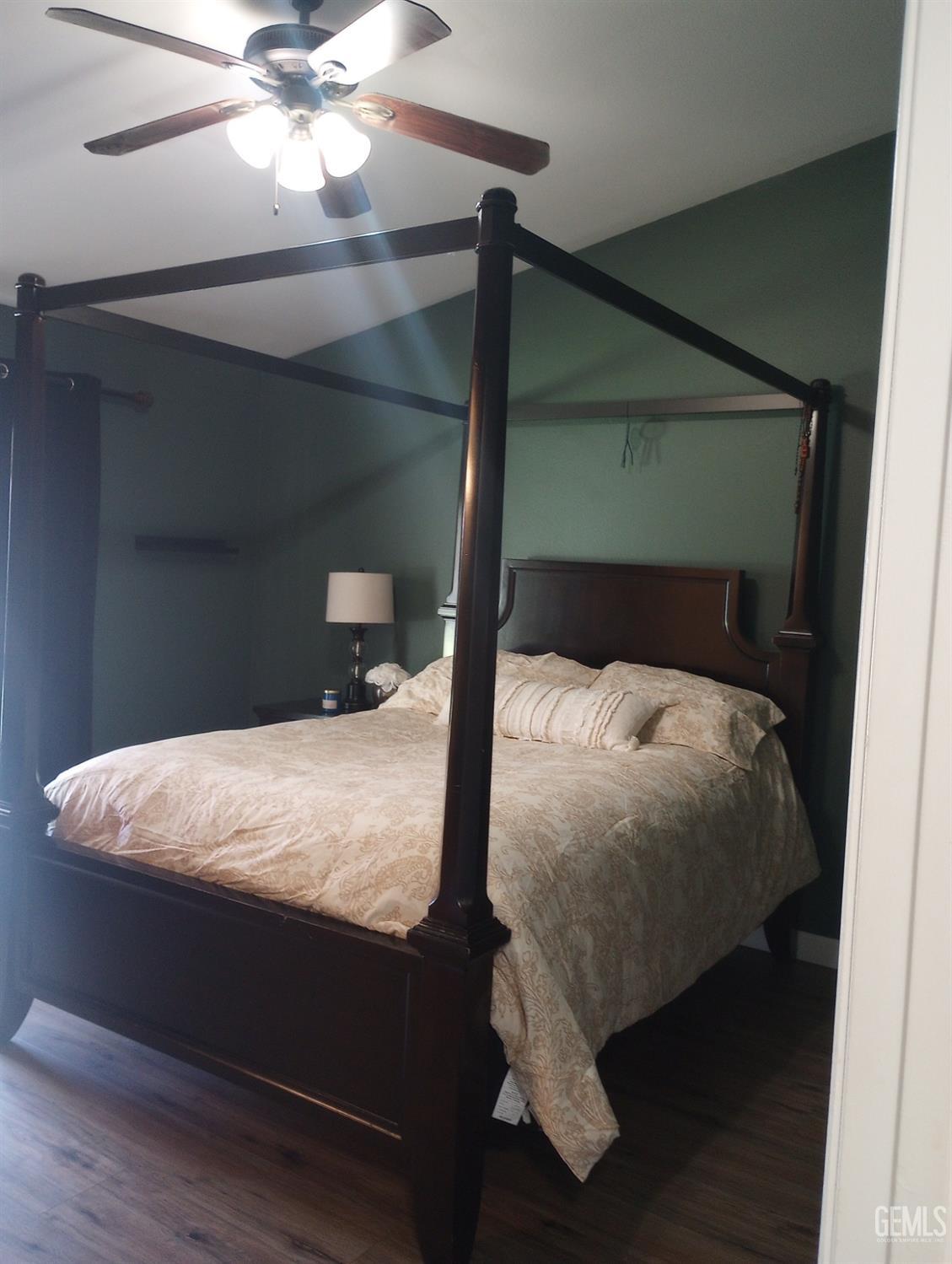 Undisclosed Address Bakersfield, CA 93313 - Photo 10 of 18 a bed sitting in a bedroom next to a window