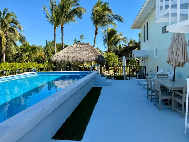 a view of swimming pool with chairs