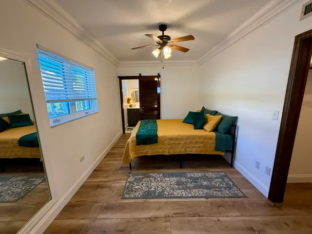 a bedroom with furniture and window