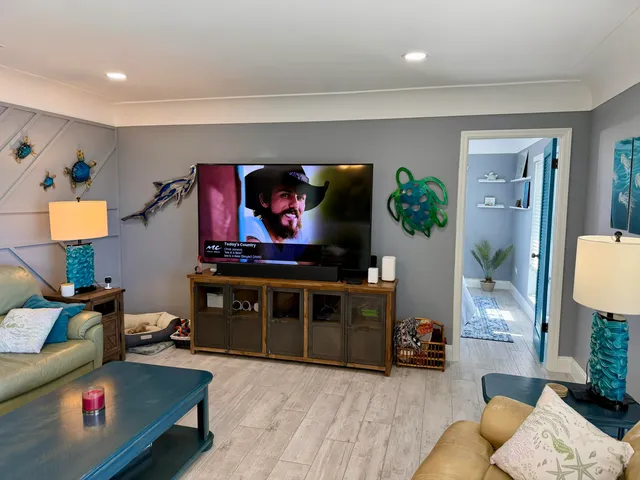 a living room with furniture and a flat screen tv